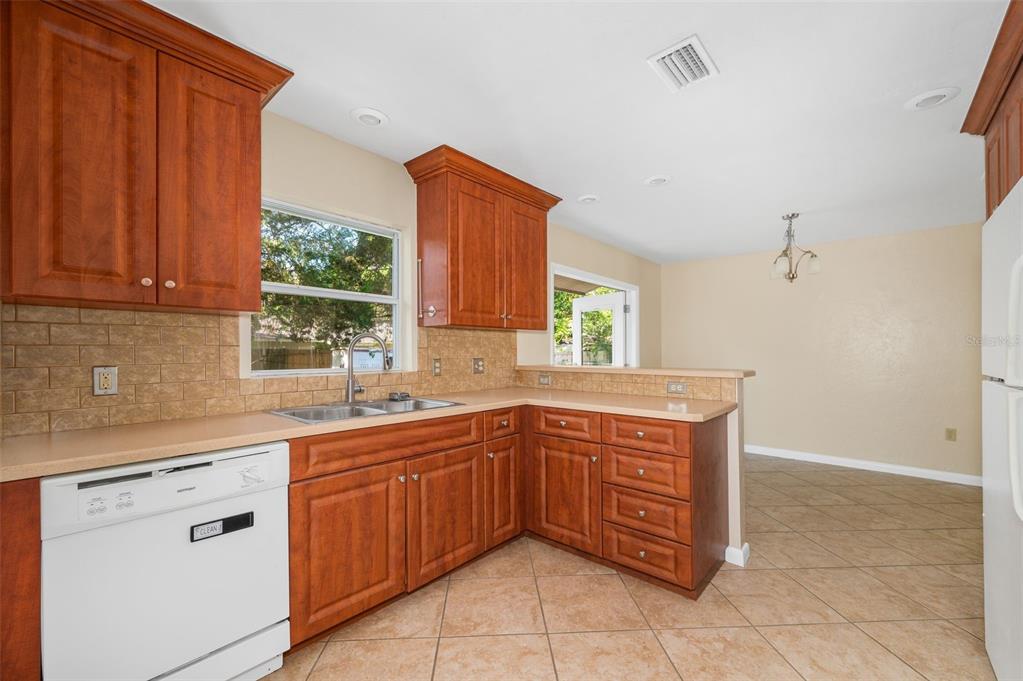 26443 Southwest 3rd Place Newberry, FL 32669 - Photo 12 of 26 a kitchen with a sink stove and cabinets