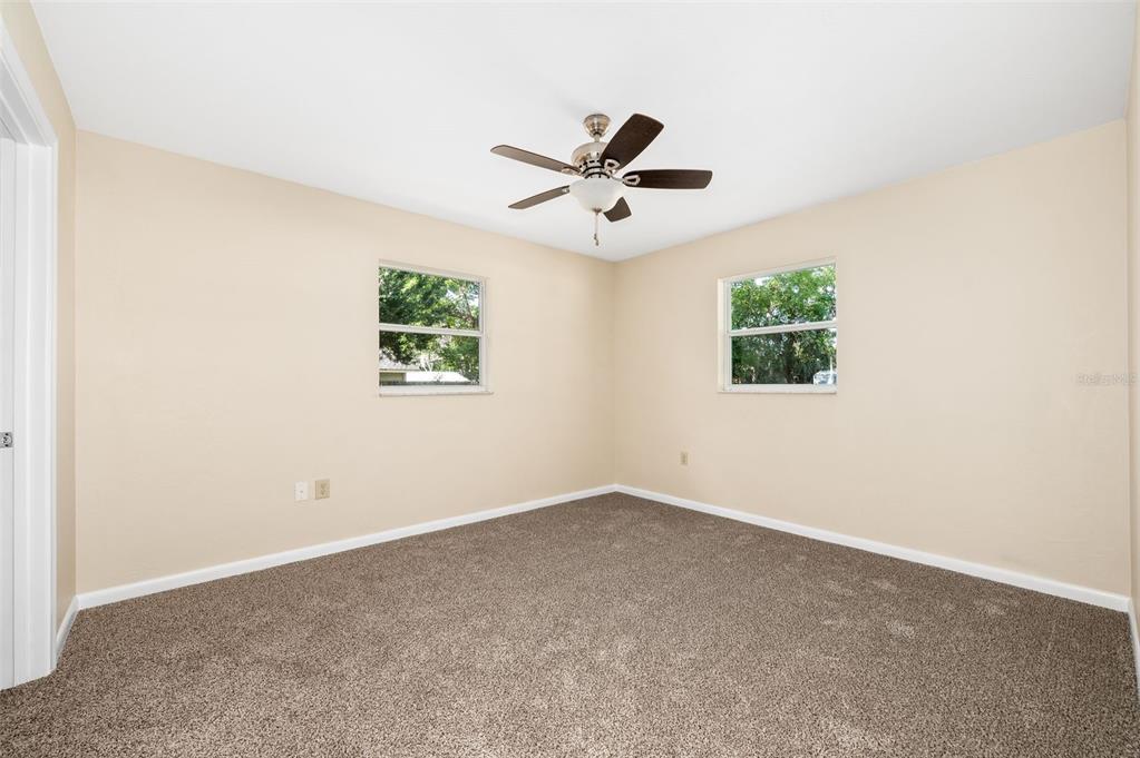 26443 Southwest 3rd Place Newberry, FL 32669 - Photo 16 of 26 an empty room with a window and a fan