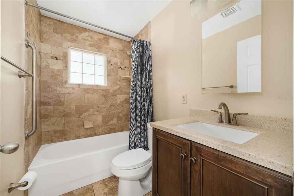 26443 Southwest 3rd Place Newberry, FL 32669 - Photo 20 of 26 a bathroom with a sink a toilet and shower