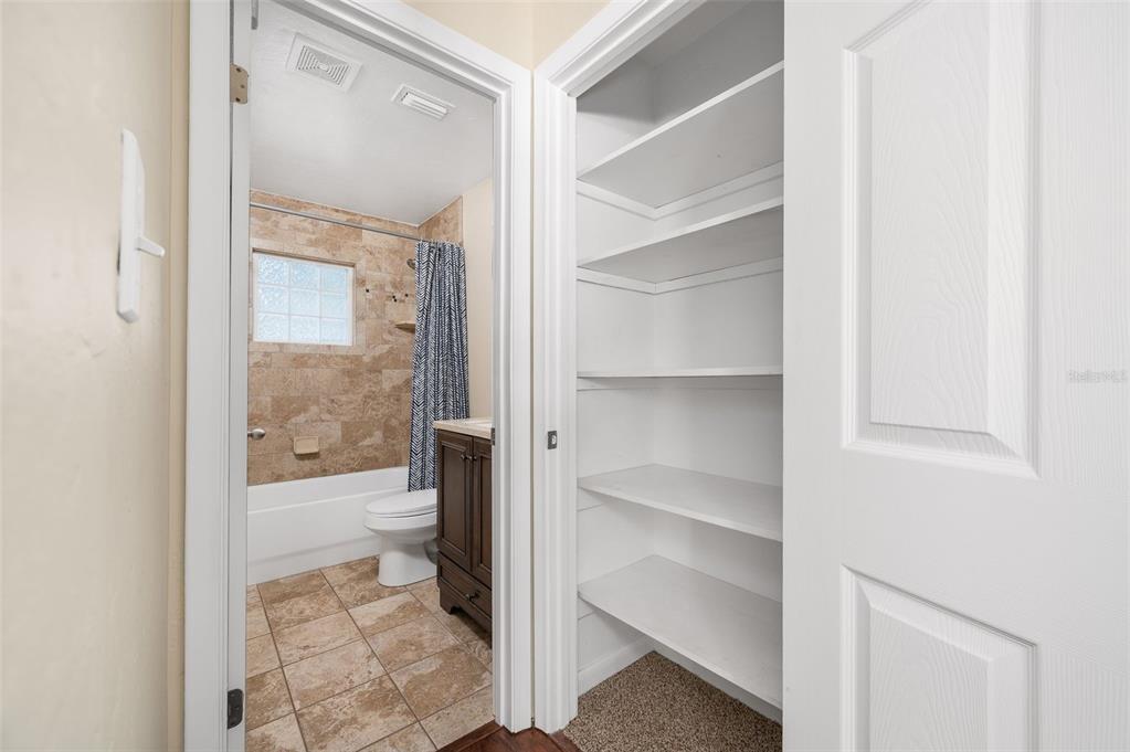 26443 Southwest 3rd Place Newberry, FL 32669 - Photo 21 of 26 a bathroom with a glass shower door