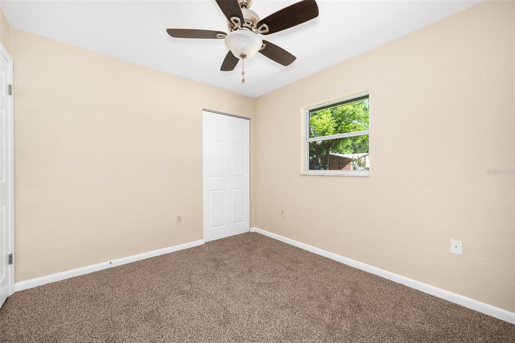 26443 Southwest 3rd Place Newberry, FL 32669 - Photo 23 of 26 an empty room with a window and a fan