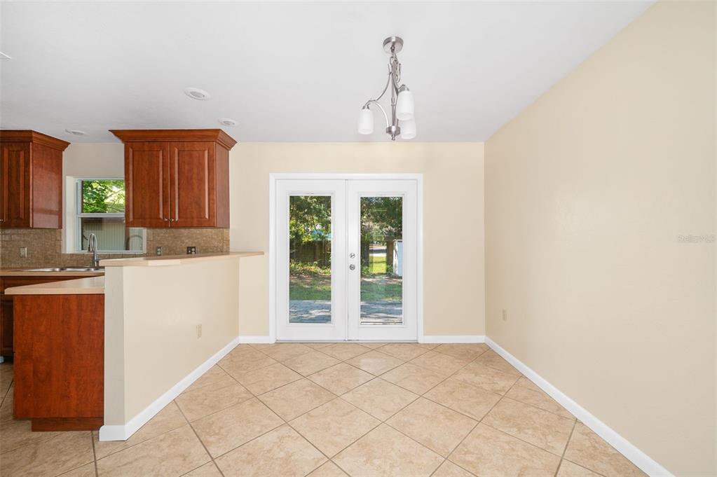 26443 Southwest 3rd Place Newberry, FL 32669 - Photo 7 of 26 a view of a kitchen with a sink and a window