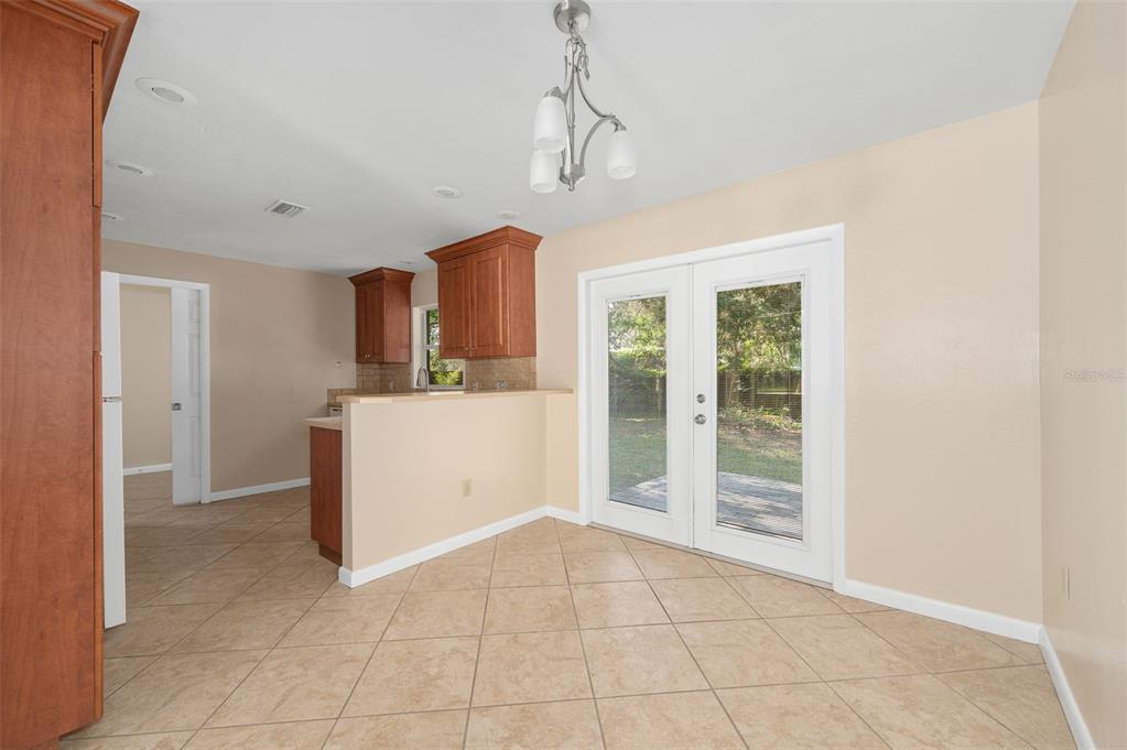 26443 Southwest 3rd Place Newberry, FL 32669 - Photo 9 of 26 a view of a kitchen with a sink and a refrigerator