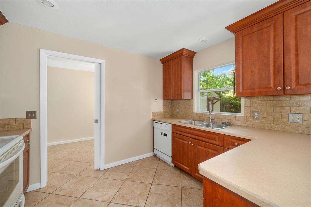 26443 Southwest 3rd Place Newberry, FL 32669 - Photo 10 of 26 a kitchen that has a sink and a stove in it