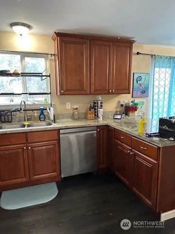 a kitchen with sink and cabinets