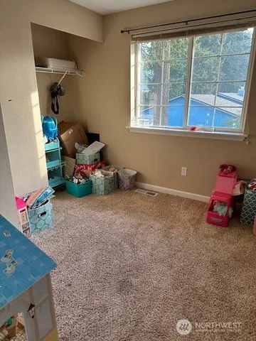 a children room with toys and a floor to ceiling window