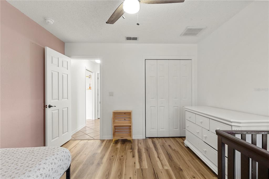 9917 Nelson Road Dade City, FL 33525 - Photo 30 of 40 a view of room with hardwood floor