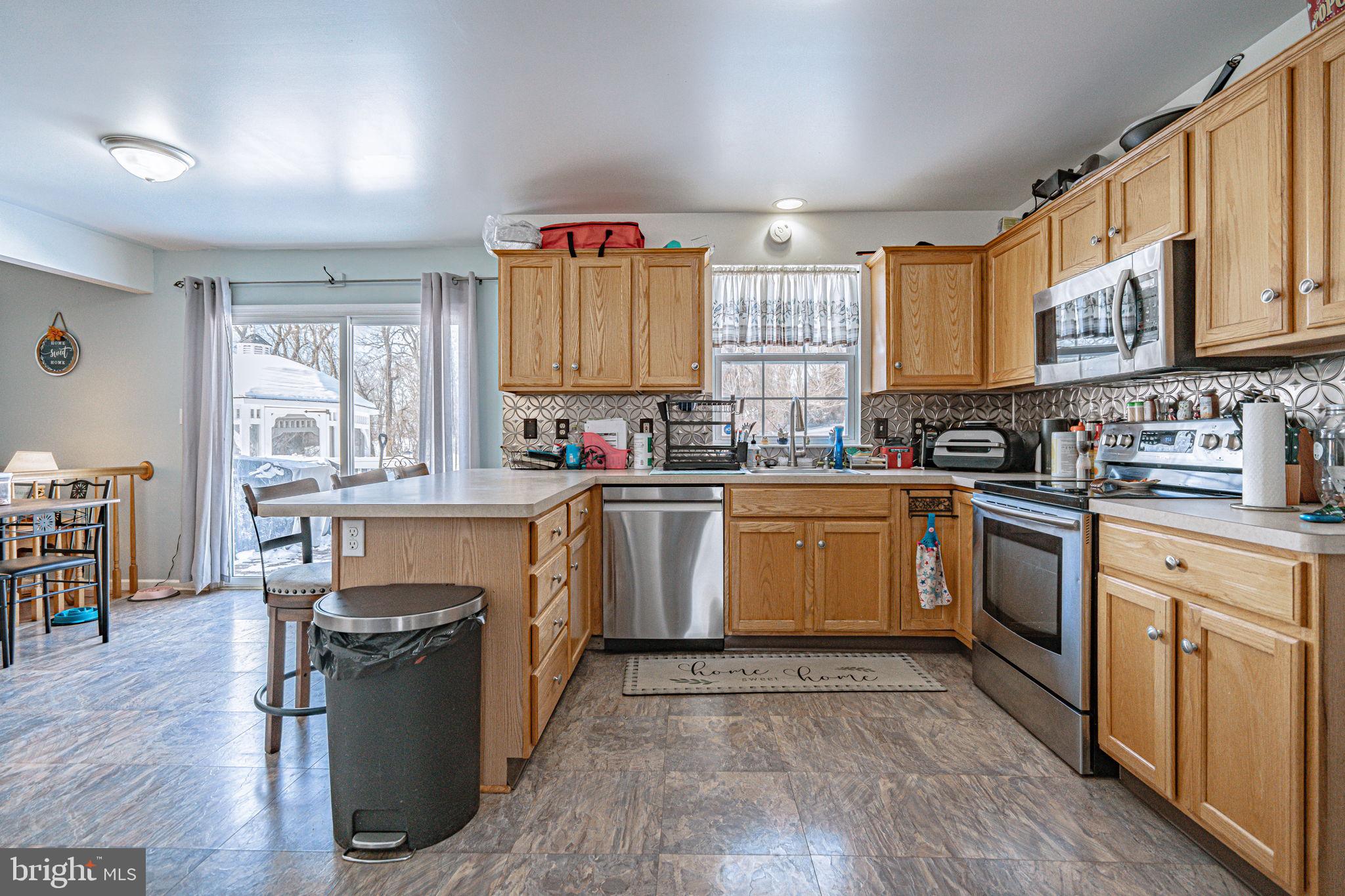35 Ridgeview Drive Lehighton, PA 18235 - Photo 12 of 58 a kitchen with granite countertop a stove top oven sink and cabinets