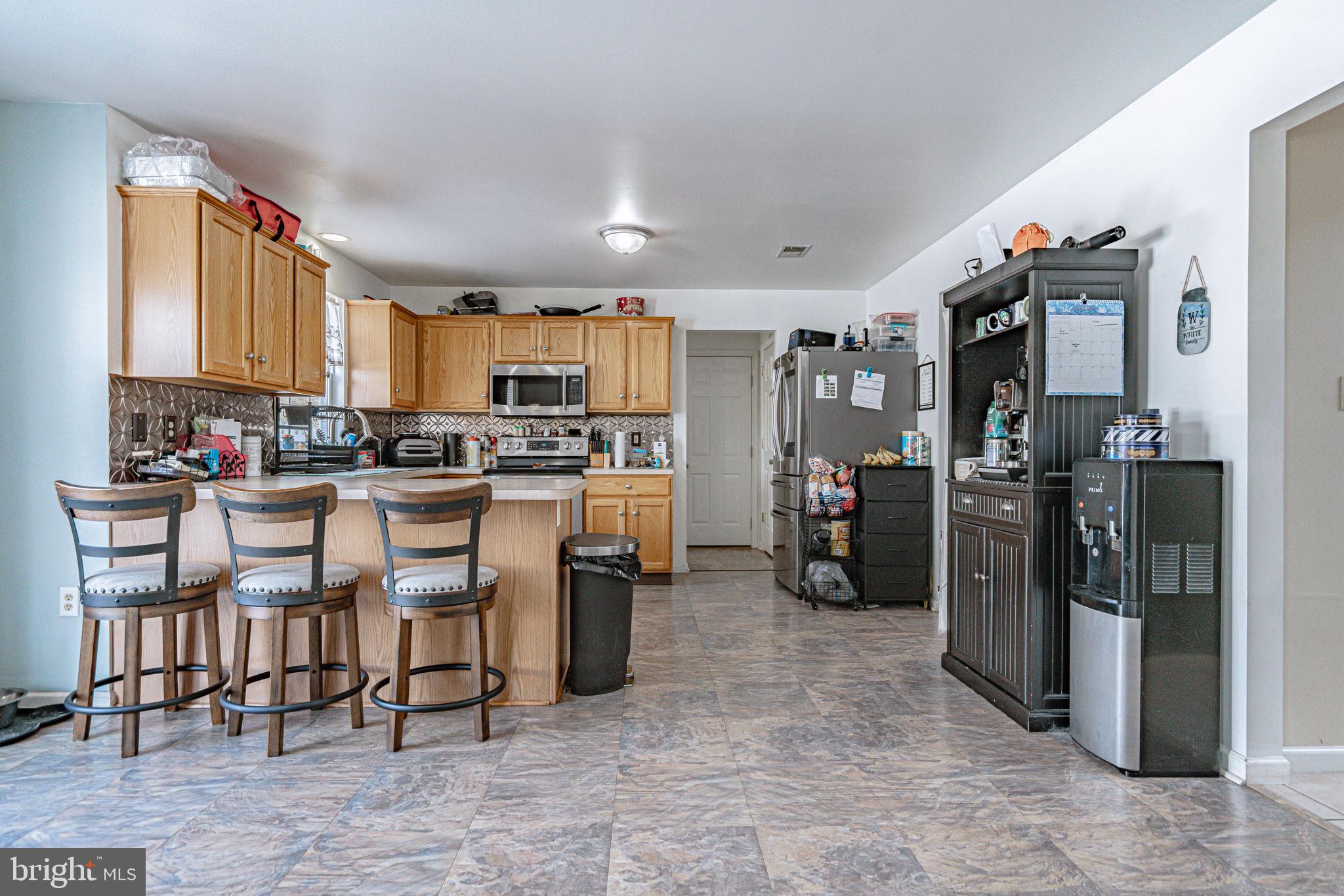 35 Ridgeview Drive Lehighton, PA 18235 - Photo 16 of 58 a kitchen with refrigerator and chairs