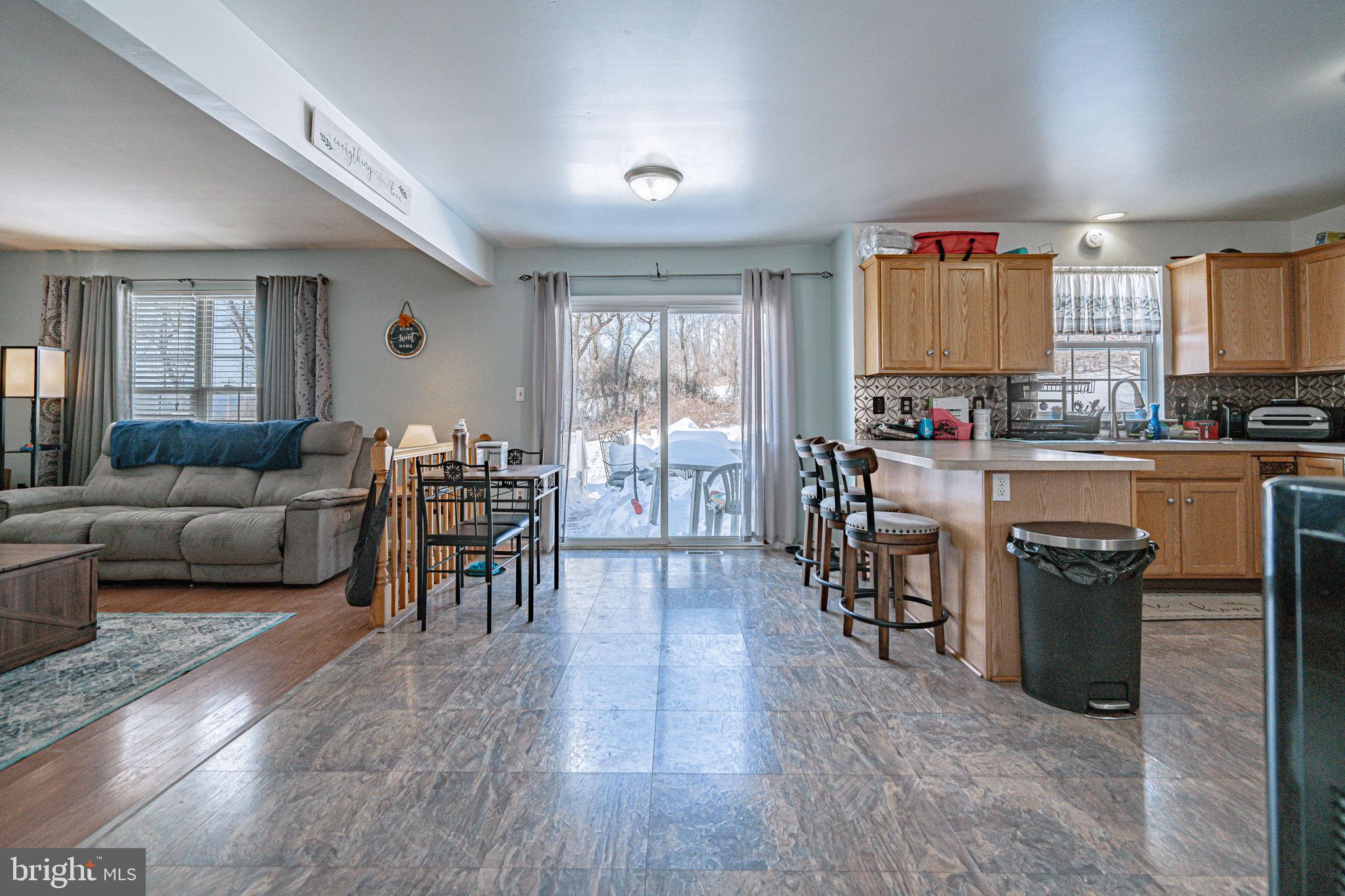 35 Ridgeview Drive Lehighton, PA 18235 - Photo 17 of 58 a living room with furniture a dining table wooden floor and a large window