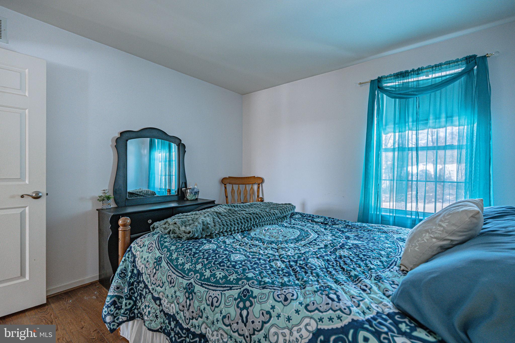 35 Ridgeview Drive Lehighton, PA 18235 - Photo 31 of 58 a bedroom with a bed lamp and a window