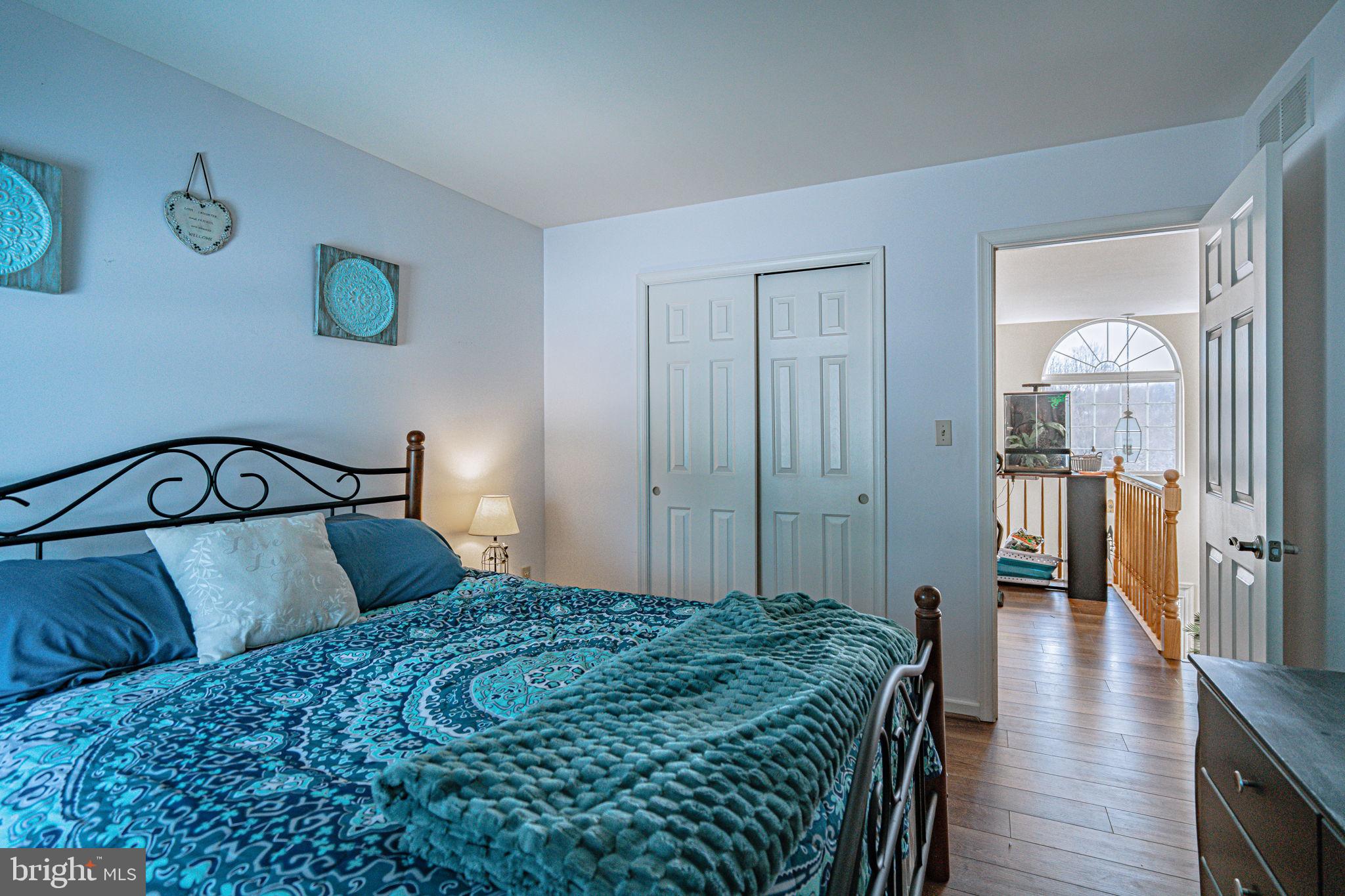 35 Ridgeview Drive Lehighton, PA 18235 - Photo 32 of 58 a bedroom with a large bed and wooden floor