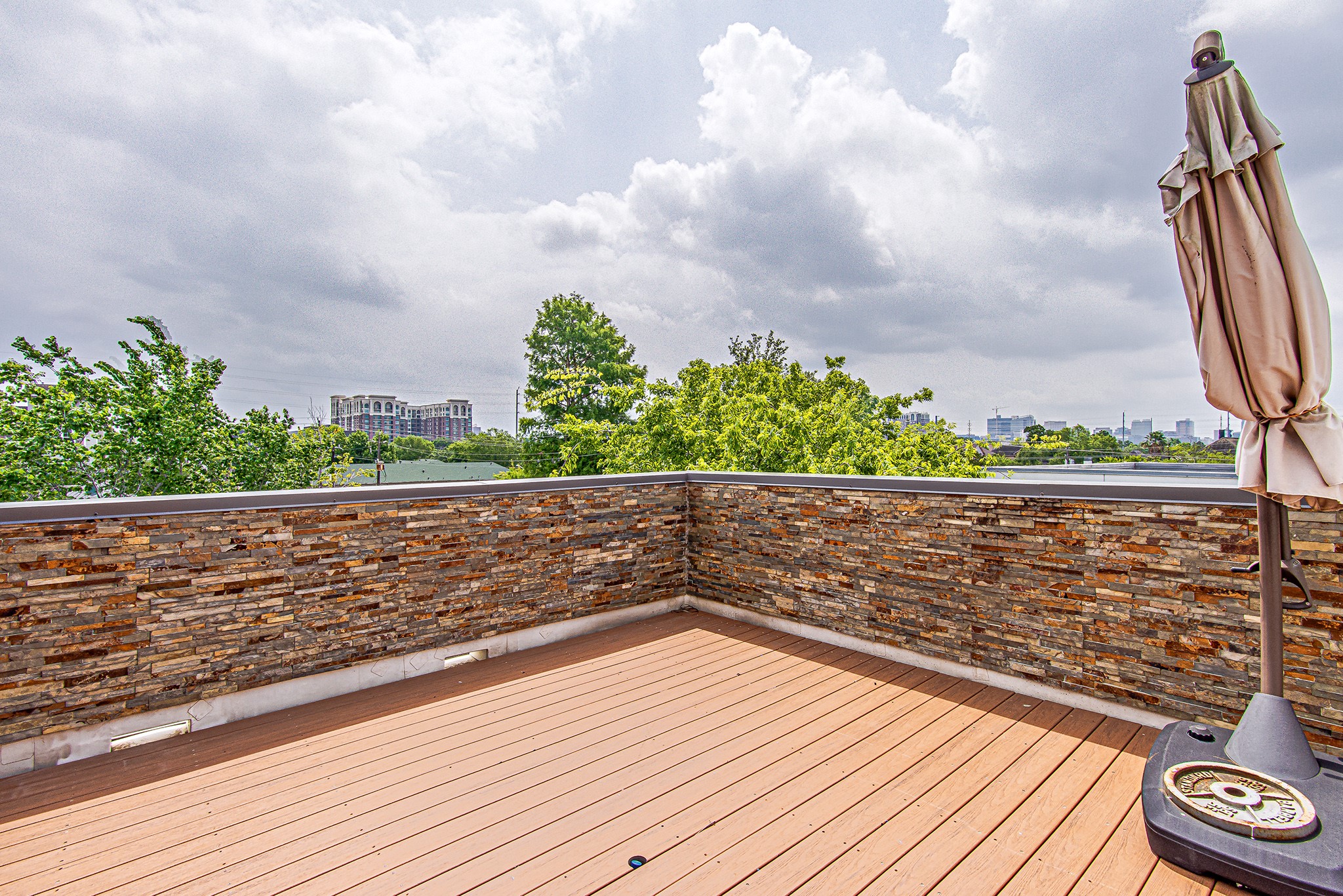2025 Colquitt Street, Unit E Houston, TX 77098 - Photo 25 of 29 Rooftop terrace offering open views and a relaxing outdoor setting.