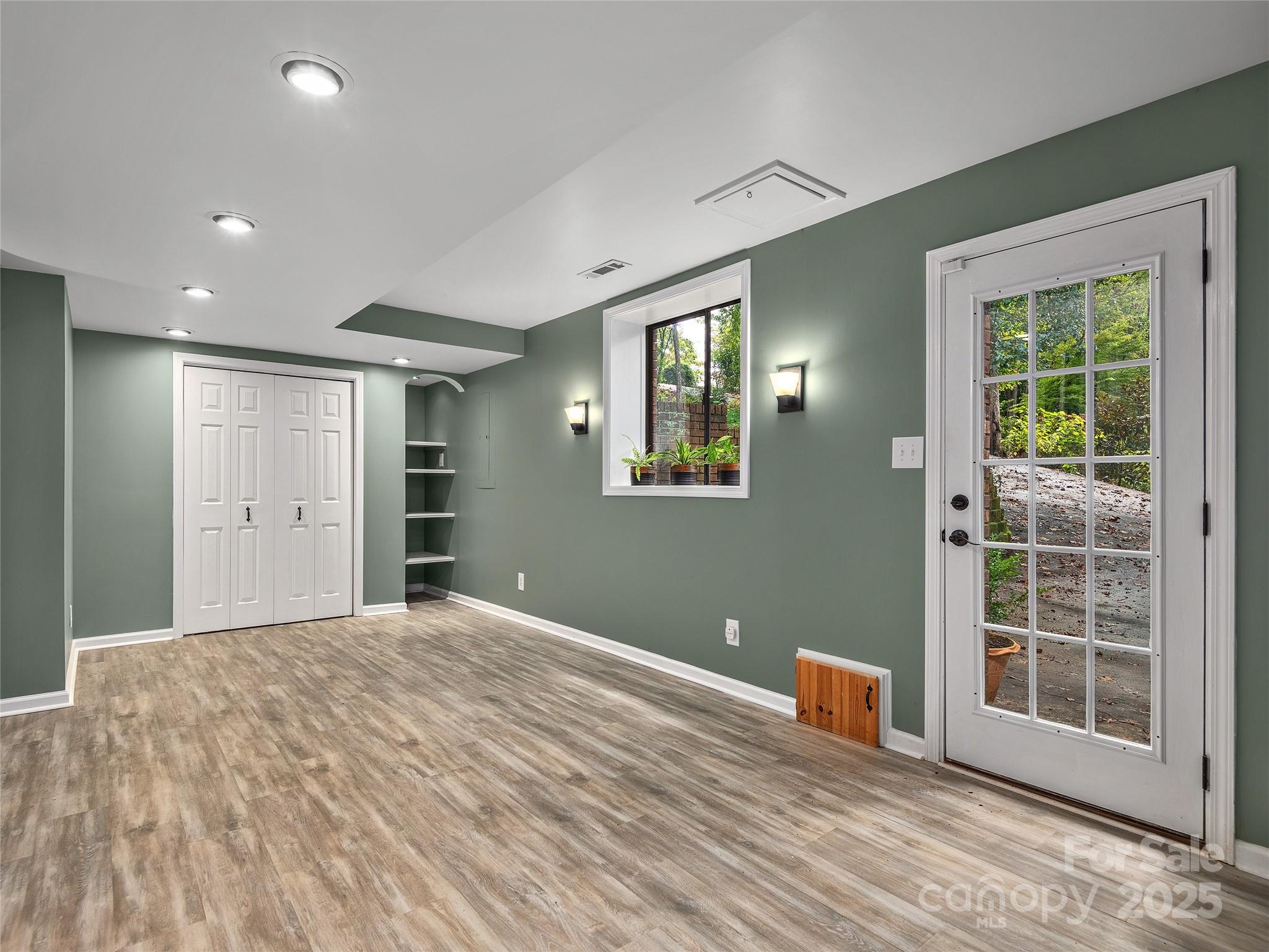 66 High Country Road Weaverville, NC 28787 - Photo 24 of 36 a view of a livingroom with wooden floor and windows