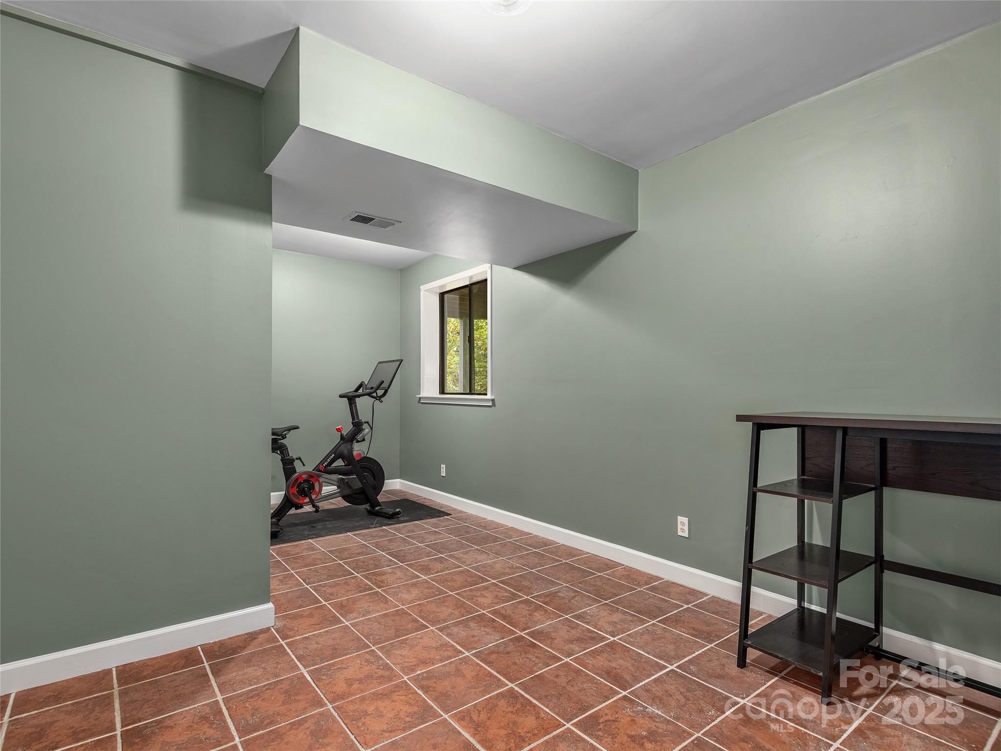 66 High Country Road Weaverville, NC 28787 - Photo 28 of 36 a bedroom with a bed and a window