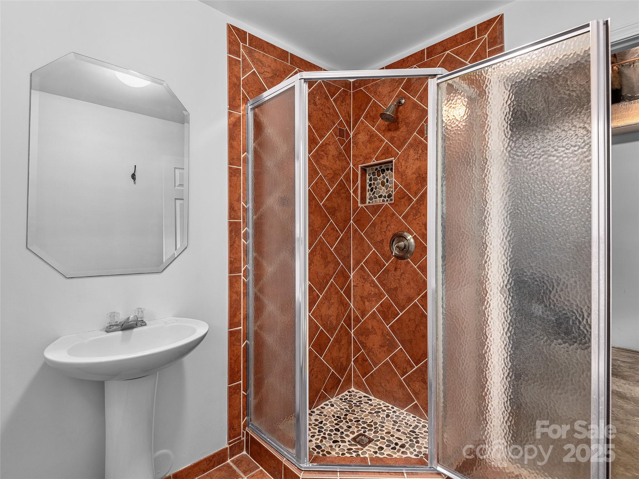 66 High Country Road Weaverville, NC 28787 - Photo 30 of 36 a bathroom with a sink and a mirror
