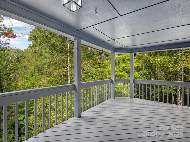 a view of balcony with wooden floor