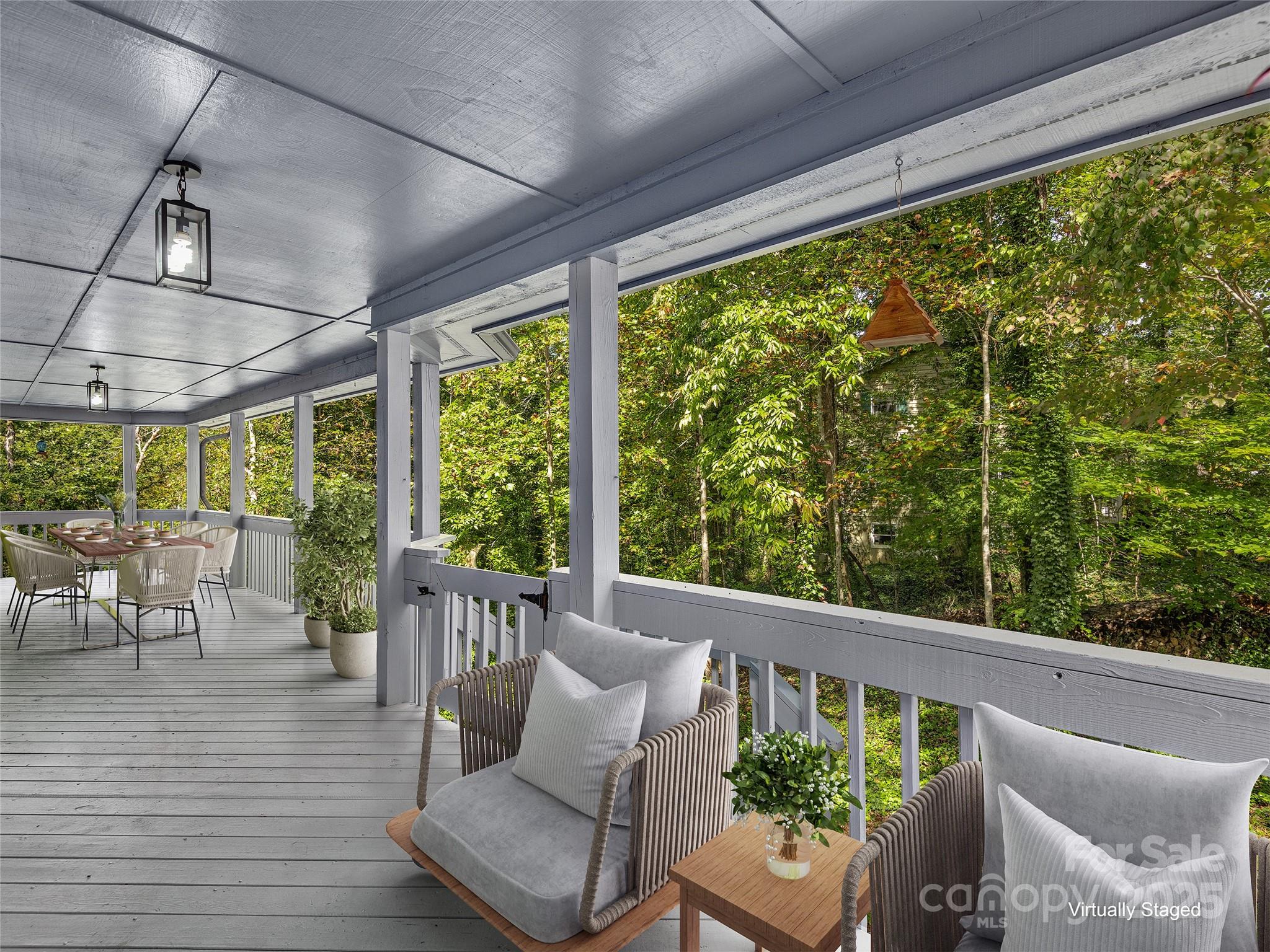 66 High Country Road Weaverville, NC 28787 - Photo 6 of 36 a balcony with furniture and wooden floor