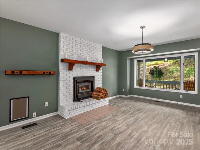 a bedroom with a bed and a fireplace