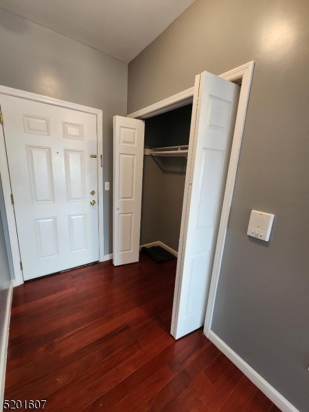 25 Cottage Street, Unit 7 Newark, NJ 07102 - Photo 1 of 5 an empty room with wooden floor and closet