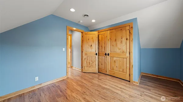 a bathroom with a granite countertop toilet sink and mirror