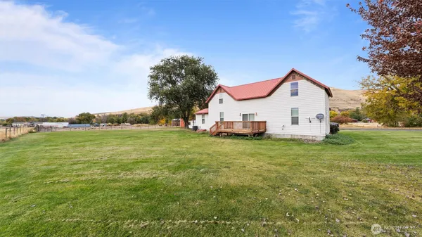 a front view of a house with a yard and a garage
