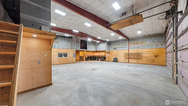a view of an empty room with a fireplace
