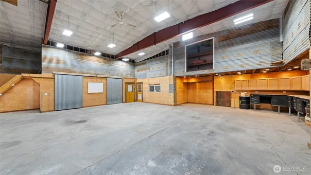 a view of an empty room with a fireplace