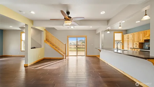 a view of an entryway with wooden floors
