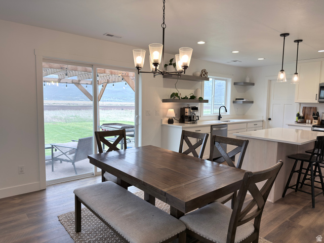 3607 South Parkinson Road South Franklin, ID 83237 - Photo 5 of 24 Dining area featuring suspended lighting and dark wood-style flooring