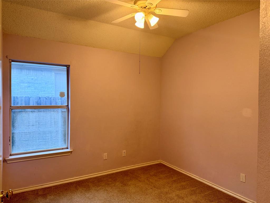 7632 Arbor Ridge Court Fort Worth, TX 76112 - Photo 12 of 19 an empty room with a window