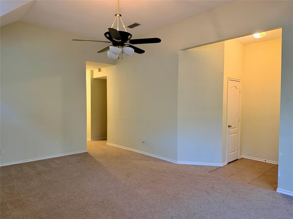 7632 Arbor Ridge Court Fort Worth, TX 76112 - Photo 3 of 19 a view of empty room with a window