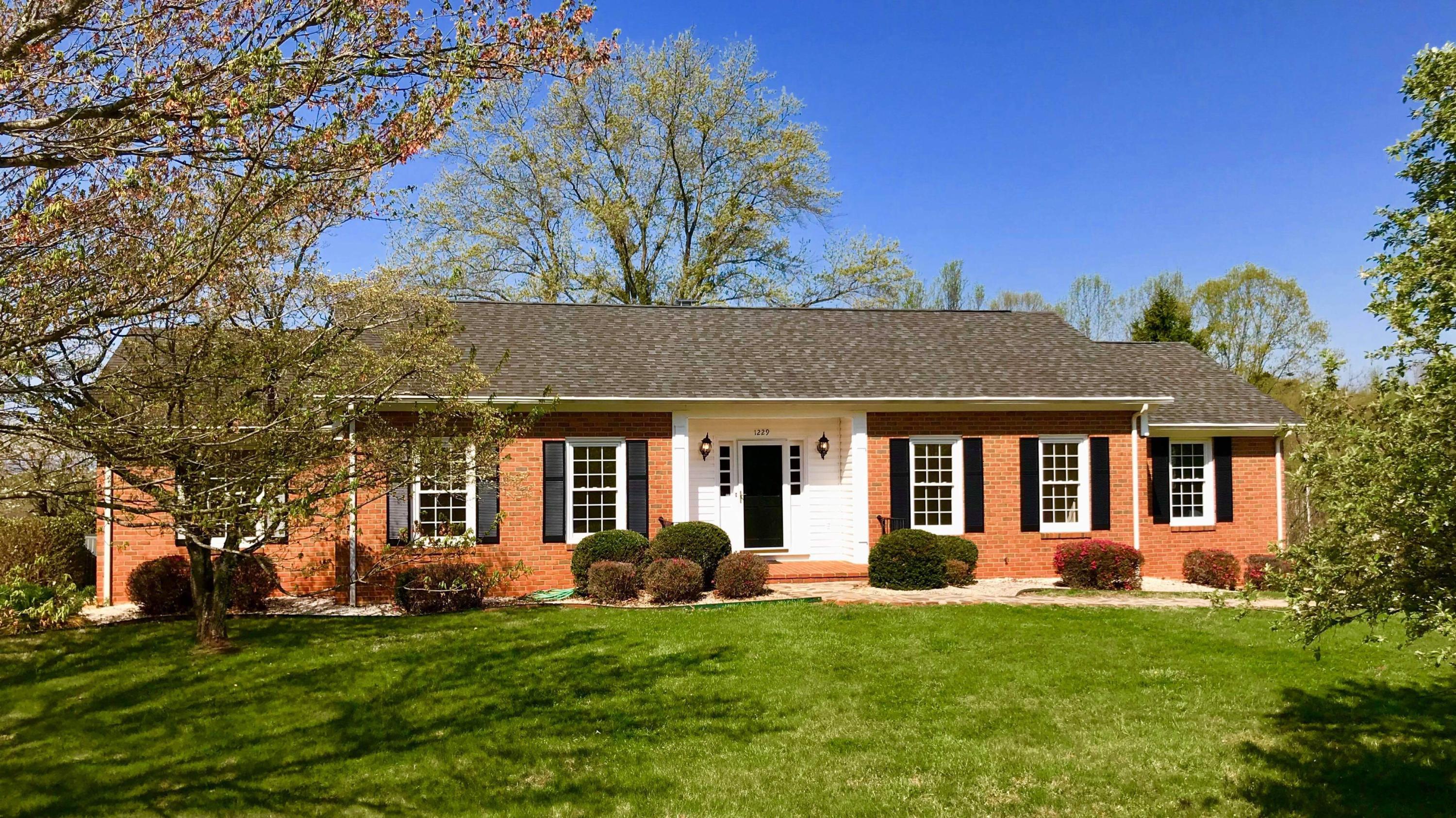 1229 Trails End Road Goodview, VA 24095 - Photo 104 of 106 front view of a house with a yard