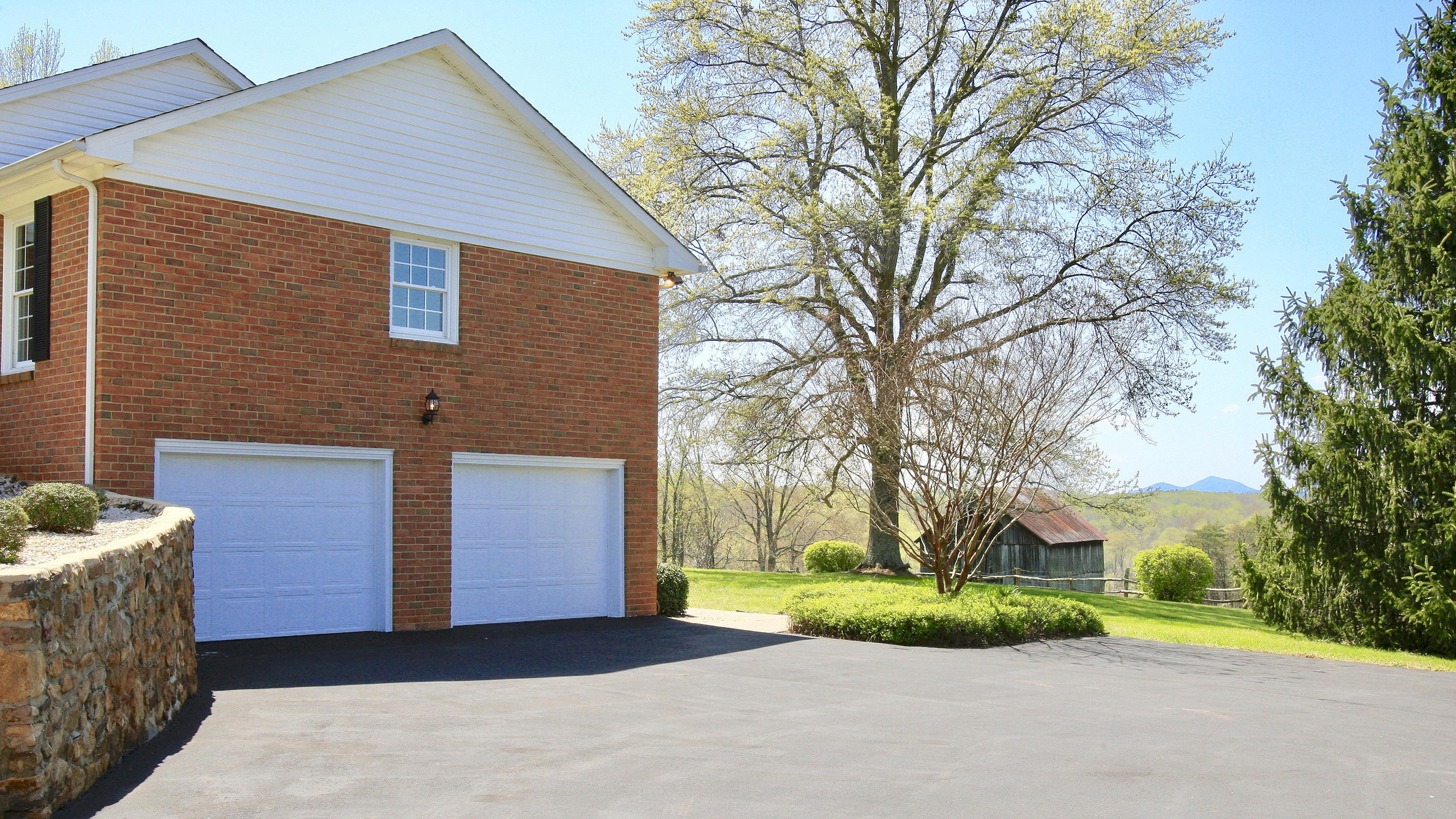 1229 Trails End Road Goodview, VA 24095 - Photo 13 of 106 a front view of a house with a yard and garage
