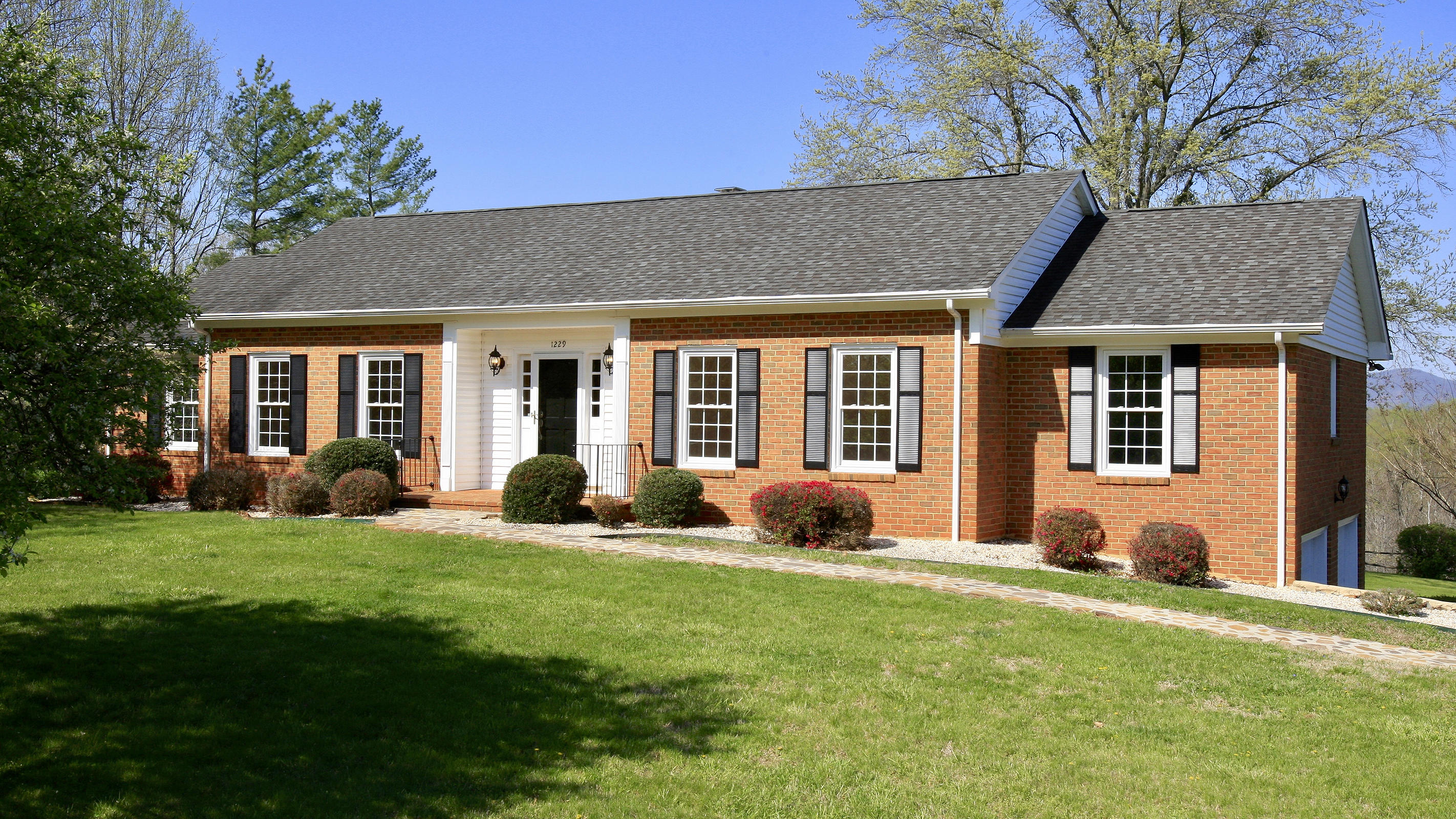 1229 Trails End Road Goodview, VA 24095 - Photo 14 of 106 a view of a house with a backyard