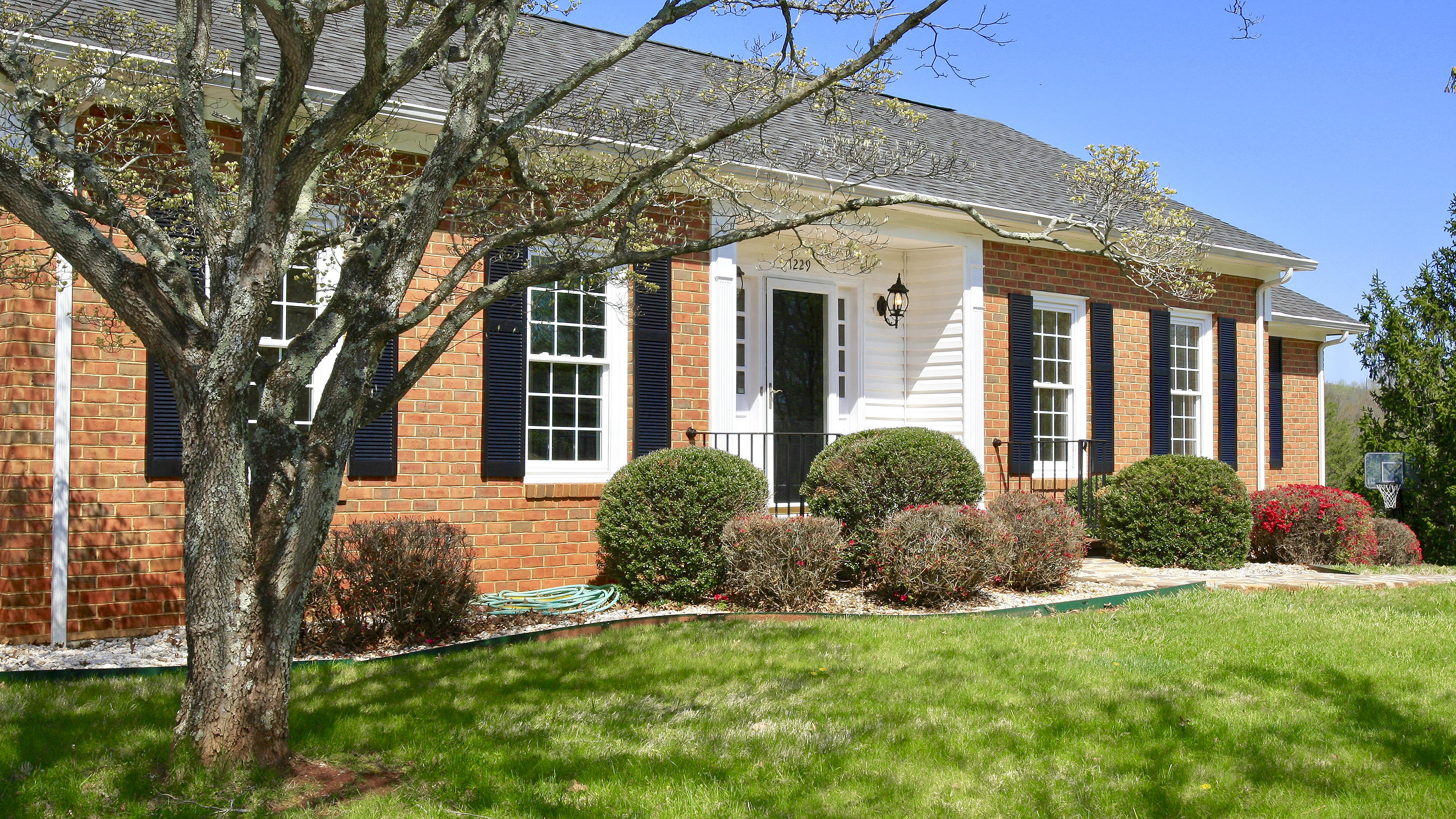 1229 Trails End Road Goodview, VA 24095 - Photo 27 of 106 front view of a house with a yard