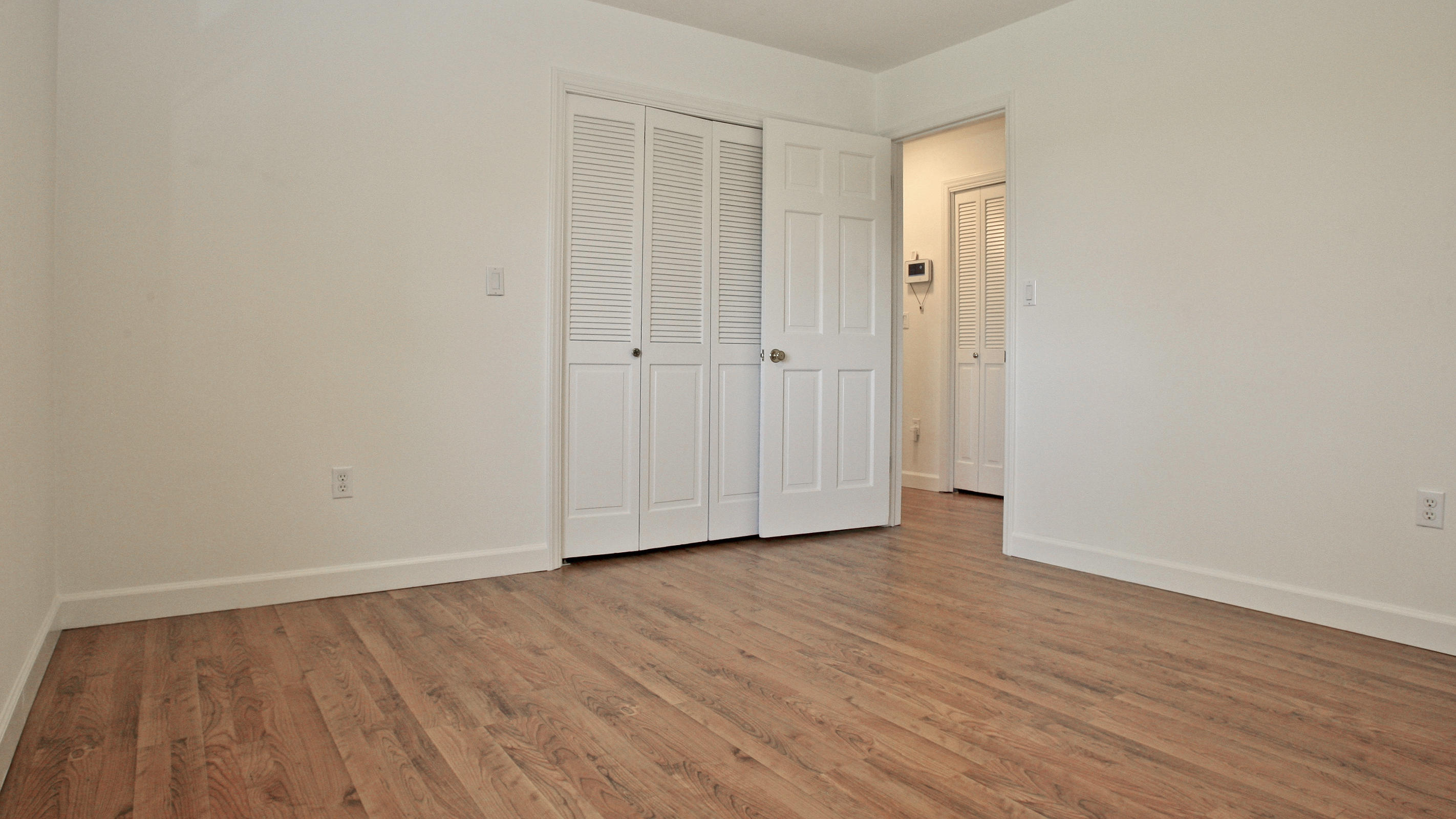 1229 Trails End Road Goodview, VA 24095 - Photo 47 of 106 a view of an empty room with wooden floor