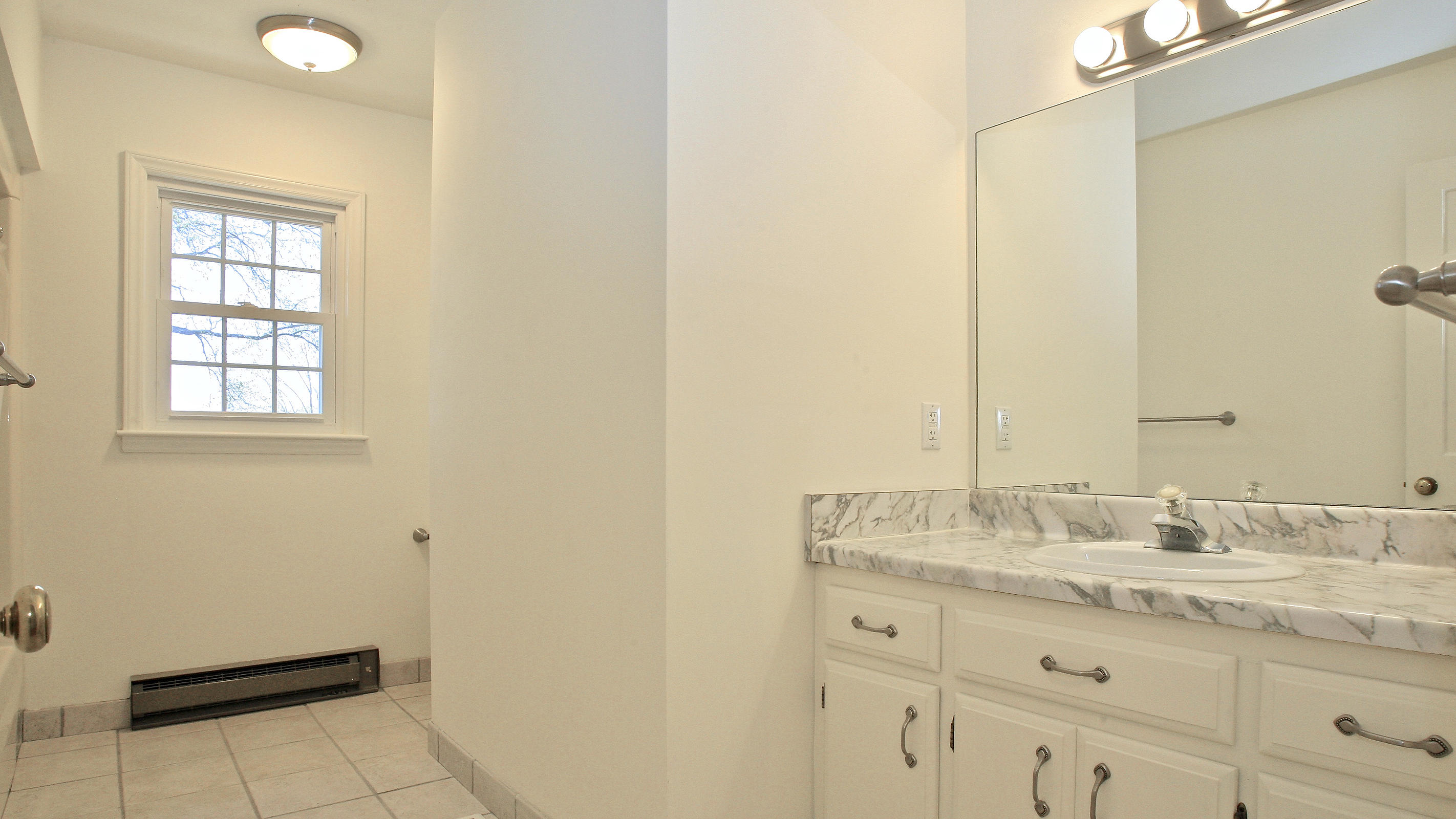 1229 Trails End Road Goodview, VA 24095 - Photo 48 of 106 a bathroom with a granite countertop sink and a mirror