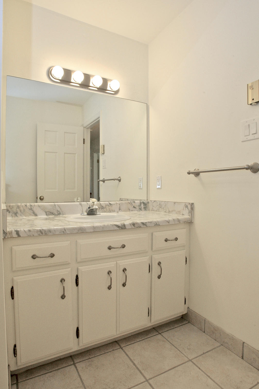 1229 Trails End Road Goodview, VA 24095 - Photo 50 of 106 a bathroom with a granite countertop sink and a mirror