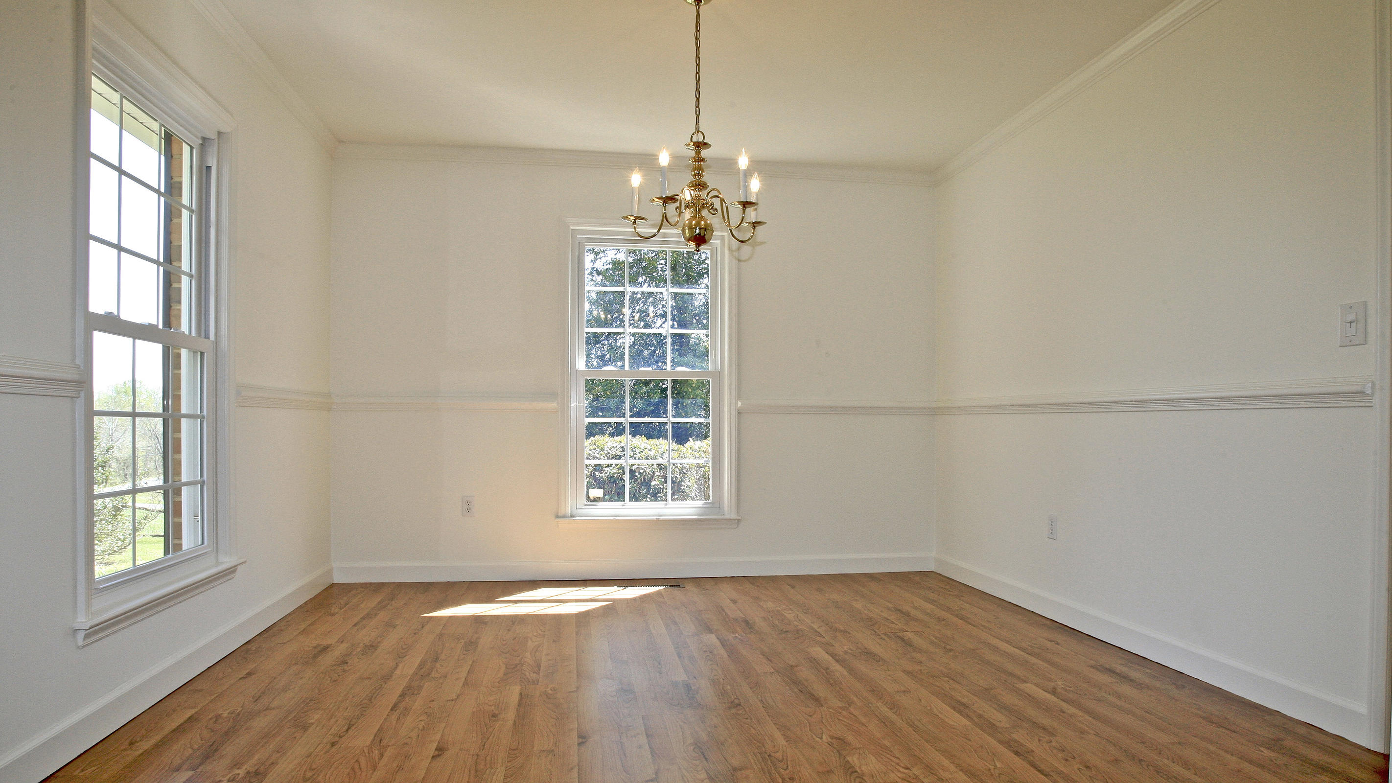1229 Trails End Road Goodview, VA 24095 - Photo 63 of 106 a view of an empty room with wooden floor and a window