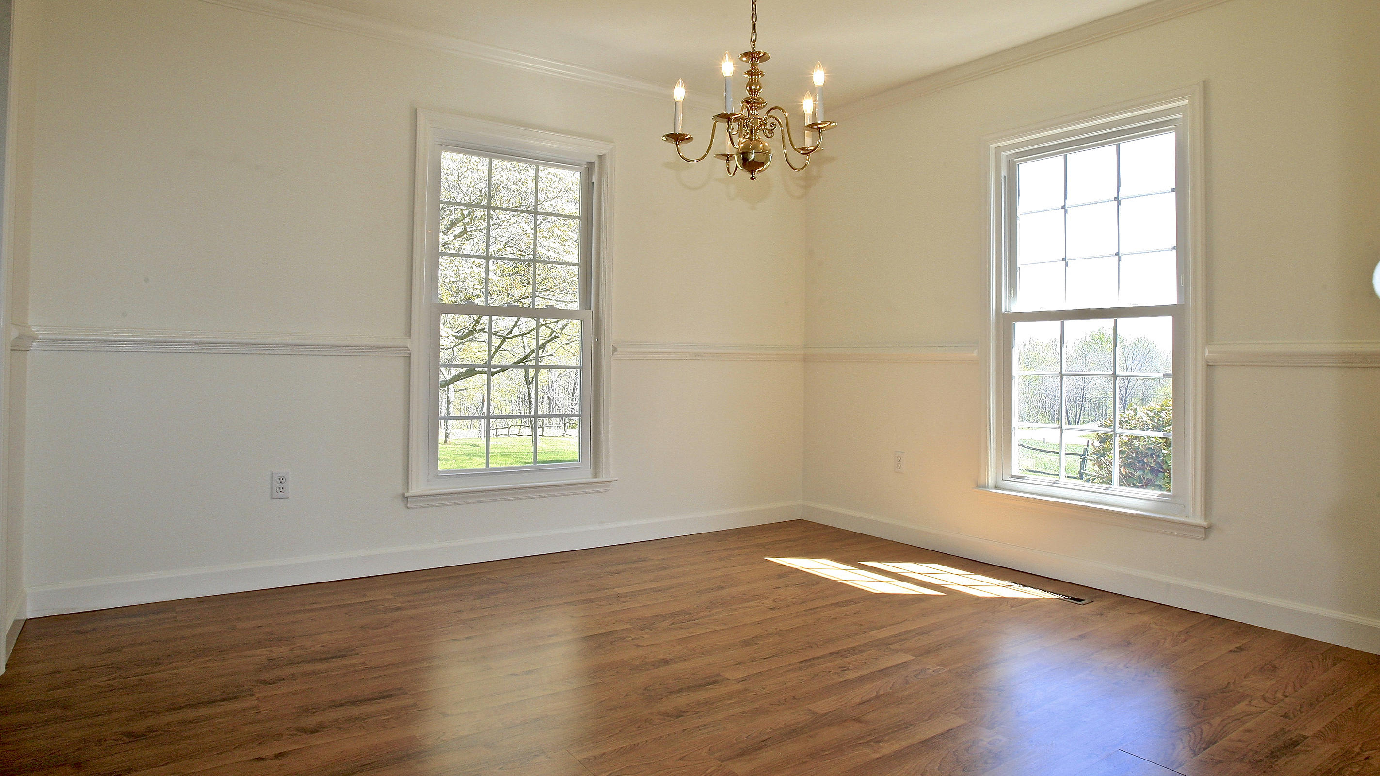 1229 Trails End Road Goodview, VA 24095 - Photo 64 of 106 a view of an empty room with wooden floor and a window
