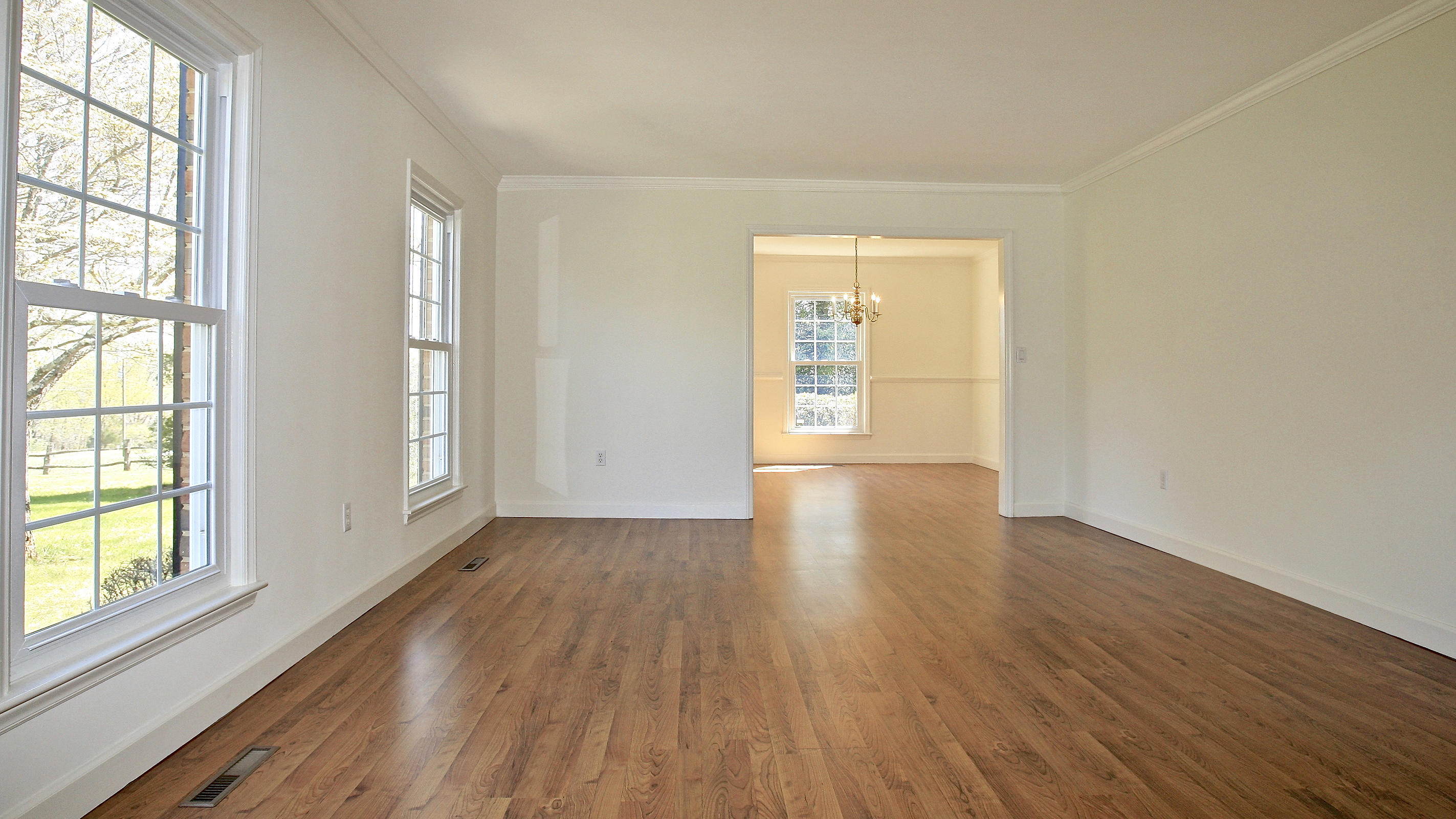 1229 Trails End Road Goodview, VA 24095 - Photo 66 of 106 an empty room with wooden floor and windows