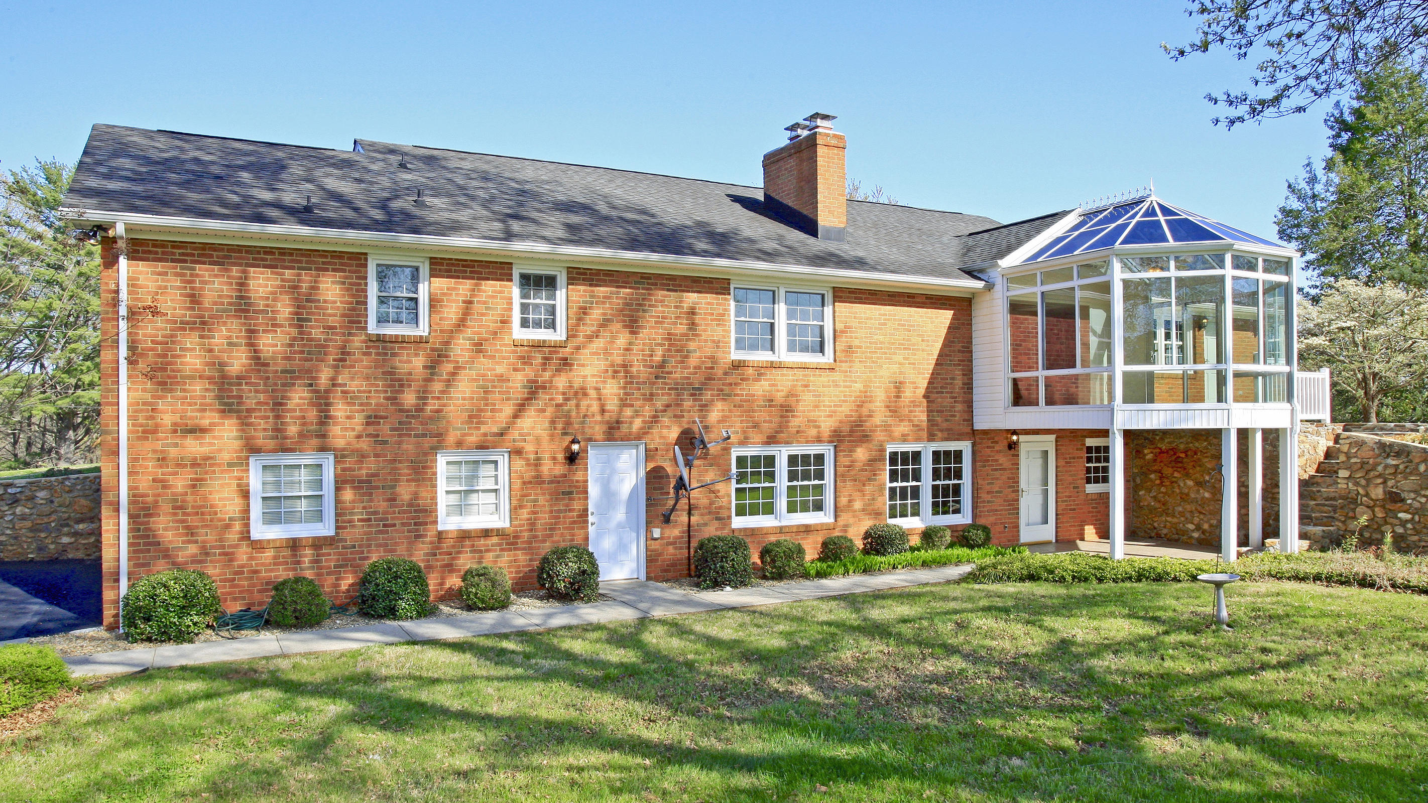 1229 Trails End Road Goodview, VA 24095 - Photo 89 of 106 a front view of a house with a garden