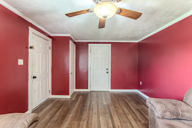 a view of a room with wooden walls