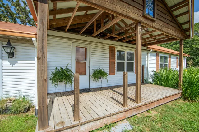 a aerial view of a house with a yard