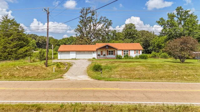 a view of a swimming pool with a yard