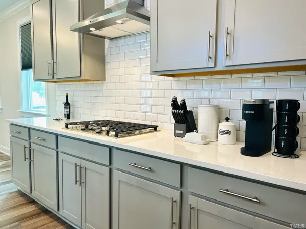 a kitchen with a sink and cabinets