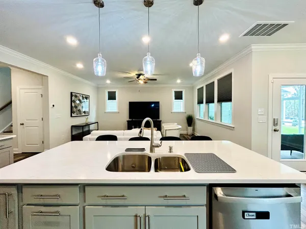 a view of a kitchen with a table and chairs
