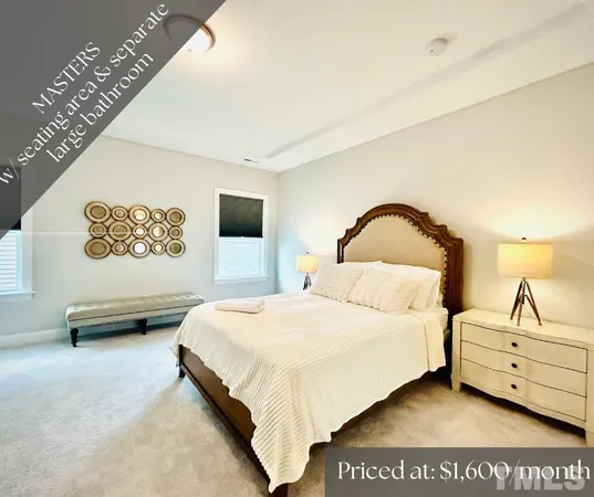 a spacious bedroom with a bed and a flat screen tv