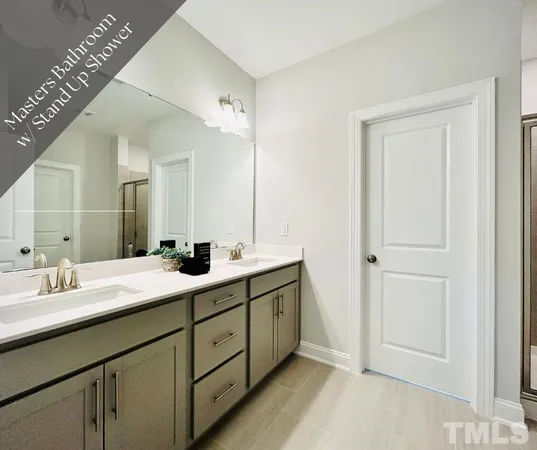 a bathroom with a glass shower door